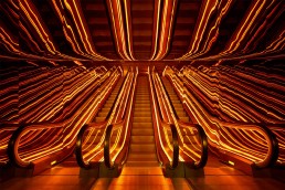 An interior shot of an escalator at Public Hotel in New York
