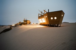 An exterior shot of Shipwreck Lodge in Namibia